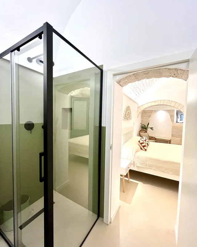 Letto matrimoniale e zona notte — riposo e relax nella suite